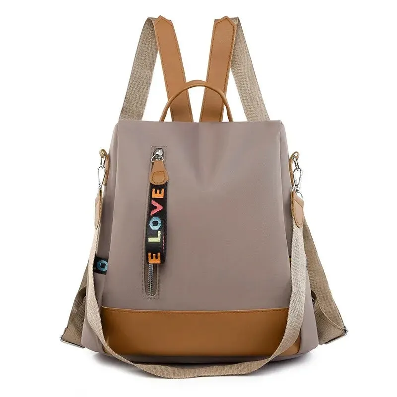 Trendy Oxford Cloth Backpack – Lightweight Casual Daypack with Charm Details